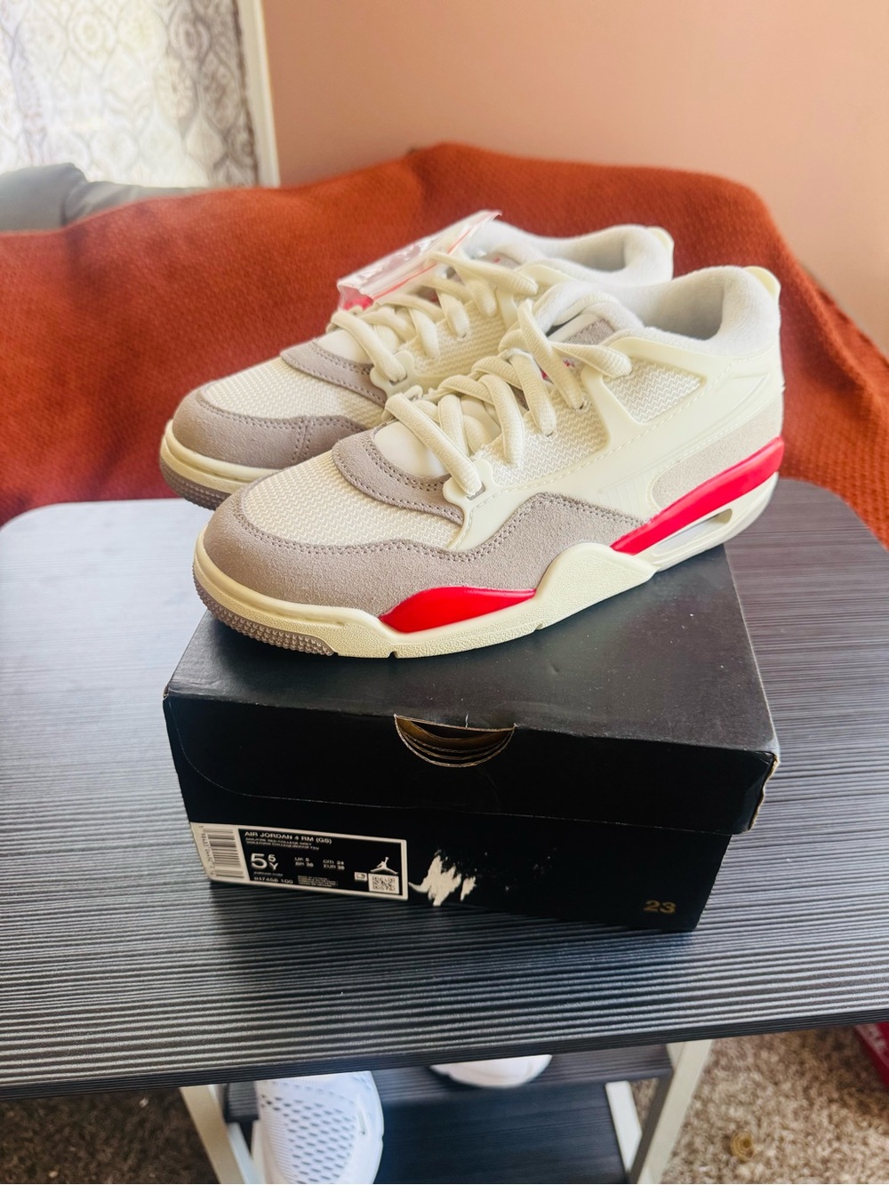 These are Nike Air Jordan 4 RM "Fire Red" sneakers in a big kids'
